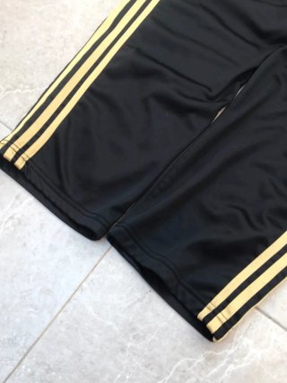Pantalón Adidas Firebird Negro y Dorado