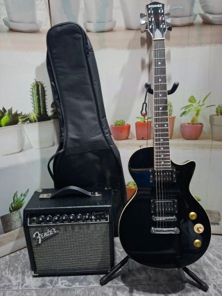 Guitarra Donner y amplificador Fender champion