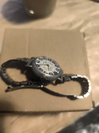 Reloj Vintages, de pulsera plateado con esfera azu