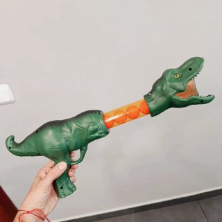 Pistola de dinosaurio con pelotas. Uso dos veces.