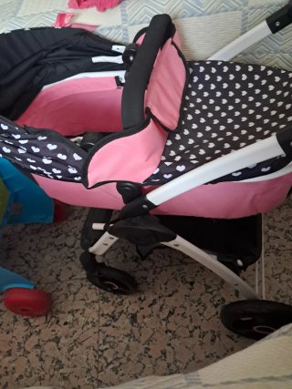 Carro de muñecas rosa y negro