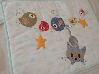 Protector de cuna infantil con animales