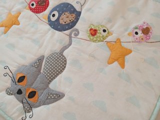 Protector de cuna infantil con animales