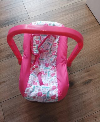 Porta bebés de juguete rosa