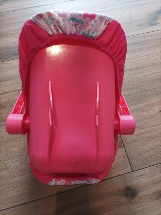 Porta bebés de juguete rosa