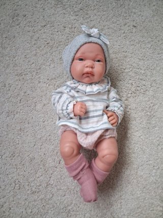 Muñeco bebé con gorrito y chupete
