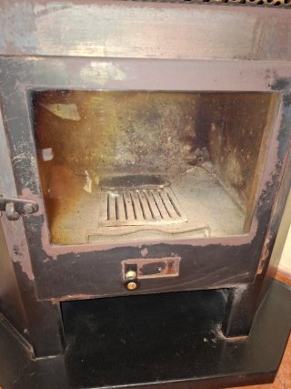 Estufa de leña de esquina negra, con turbina...