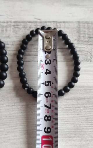 2 Pulseras Negras con Detalle Dorado