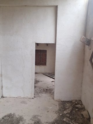 Casa de dos plantas con garaje y terreno