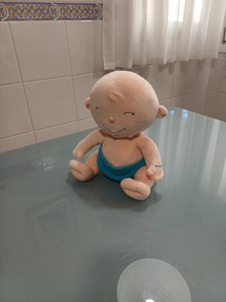 Peluche bebé  y funda pijama amarillo con pluto