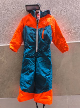 Mono de nieve infantil naranja y azul