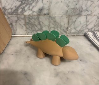 Dinosauro porta plettri