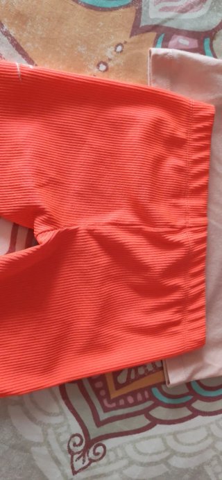 Conjunto deportivo niña Nike rosa y naranja flúor