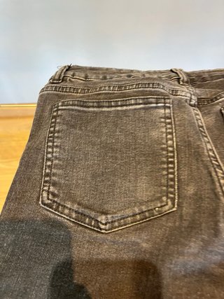 Pantalones campana negros con tachuelas
