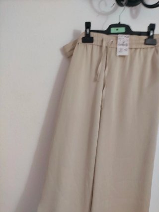 Pantalones palazzo Kiabi beige Talla L