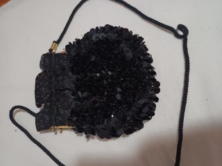 Bolso de fiesta Nina Ricci negro y dorado