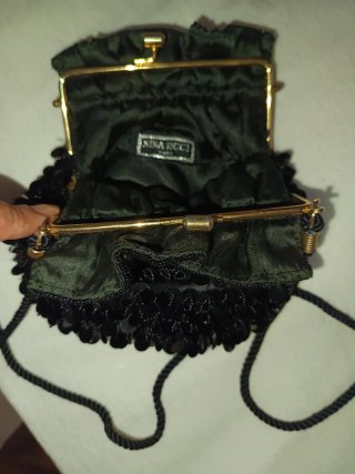 Bolso de fiesta Nina Ricci negro y dorado