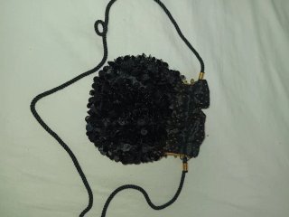 Bolso de fiesta Nina Ricci negro y dorado