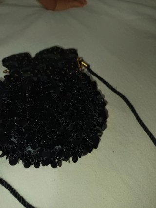 Bolso de fiesta Nina Ricci negro y dorado