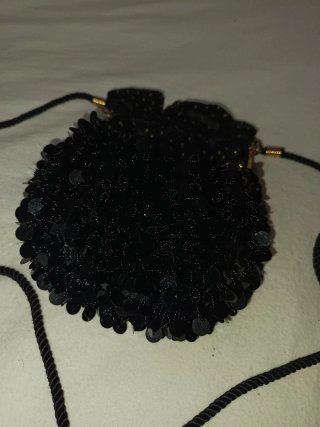 Bolso de fiesta Nina Ricci negro y dorado