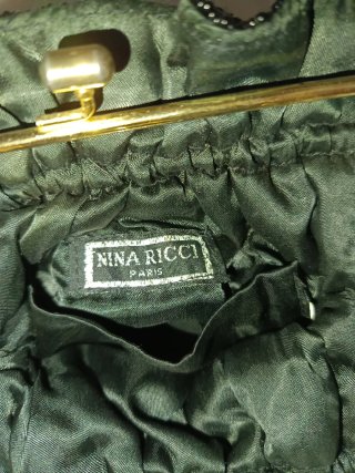 Bolso de fiesta Nina Ricci negro y dorado