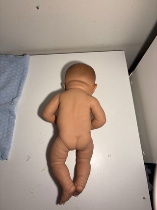 Bambola Reborn con vestitini e copertina