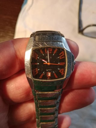 Reloj Lotus Plata y Naranja