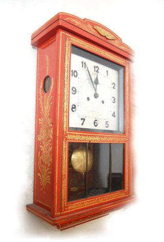 Reloj de pared antiguo rojo y dorado