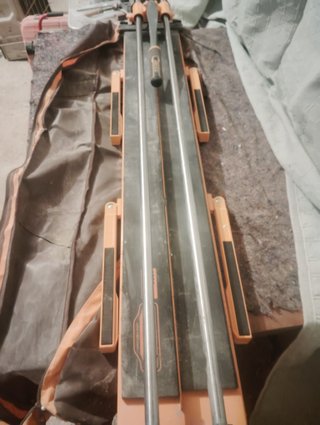 Carrete de cable y eje de transmisión