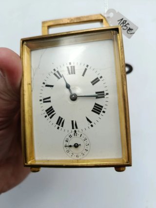RELOJ DE CARRUAJE EN BRONCE Y PORCELANA