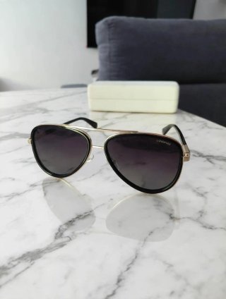 Gafas de sol Polaroid aviador negro y dorado