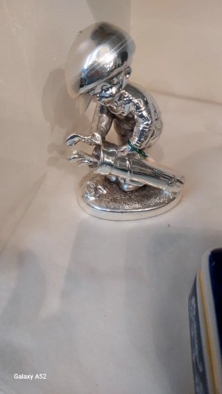 Figura golfista plata laminada