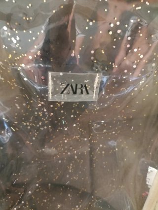 Mochila transparente con brillos niña ZARA