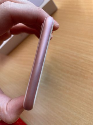iPhone 7 Rosa con 14 fundas y cargador precintado
