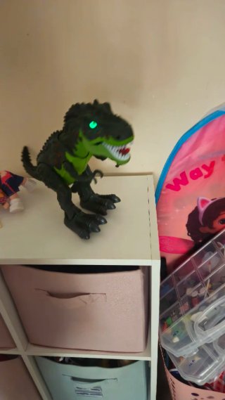 Dinosaurio de juguete con luces