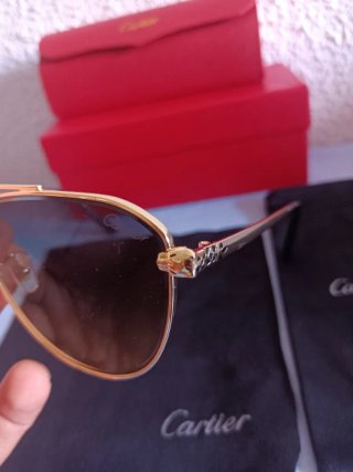 Gafas de sol Cartier doradas y negras