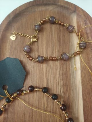 Set bracciali pietre marroni e oro
