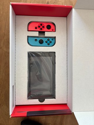 Nintendo Switch Azul/Rojo + Accesorios+ 2 Juegos