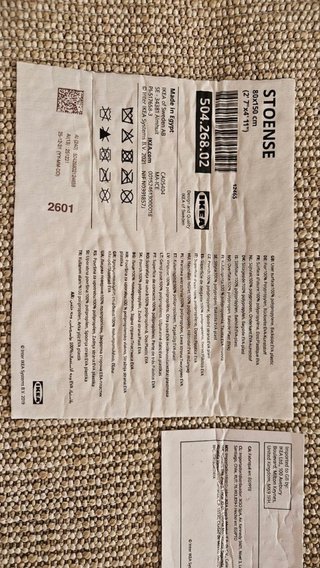 Alfombra beige de tela acrilica