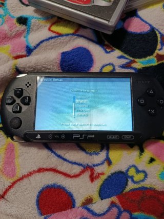 PSP con juegos, funda y cámara
