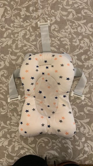 Cojín flotador ajustable para bañera