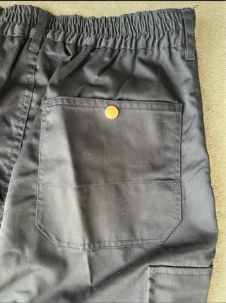 Pantaloni da lavoro blu con riflettenti