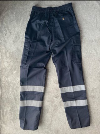 Pantaloni da lavoro blu con riflettenti