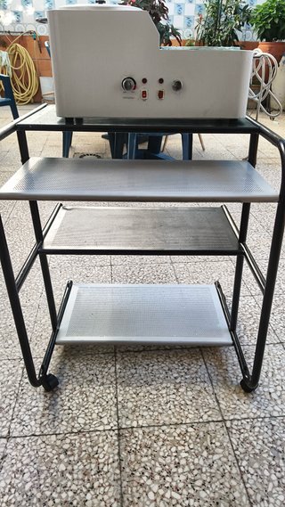 Máquina de cera y mesa auxiliar