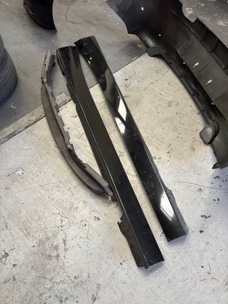 Parachoques BMW Serie 1 F20 Negro Faldones lateral