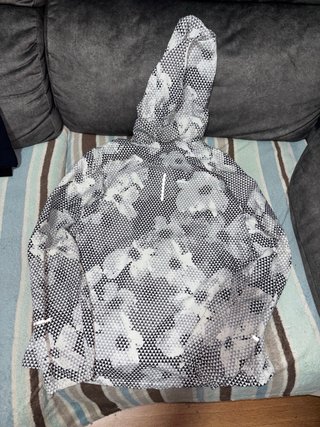 Chaqueta fina Nike gris y blanca