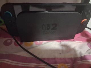 Nintendo Switch 2 con mando Pro y cables, juegos