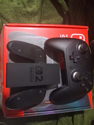 Nintendo Switch 2 con mando Pro y cables, juegos