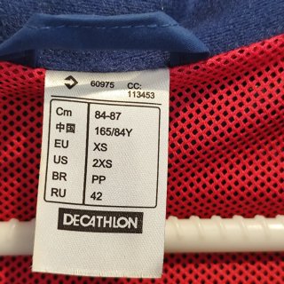 Cortavientos Quechua Azul y rojo