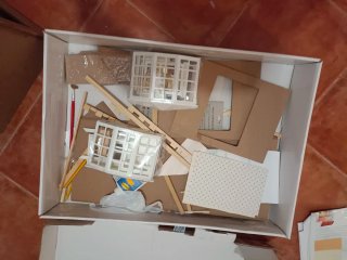 Casita de muñecas de madera.